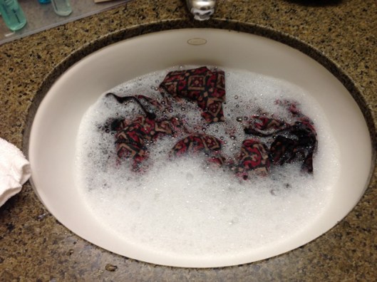 wash the clothes in a sink