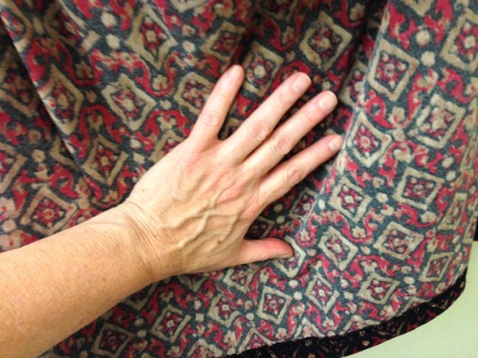 smooth the fabric to get rid of wrinkles