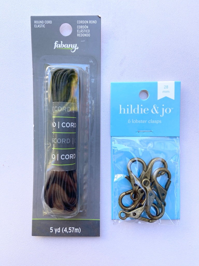 Round elastic cord and lobster clasps for the tether.